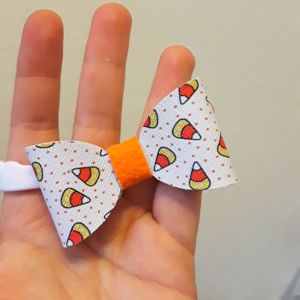 Small candy corn faux leather bow